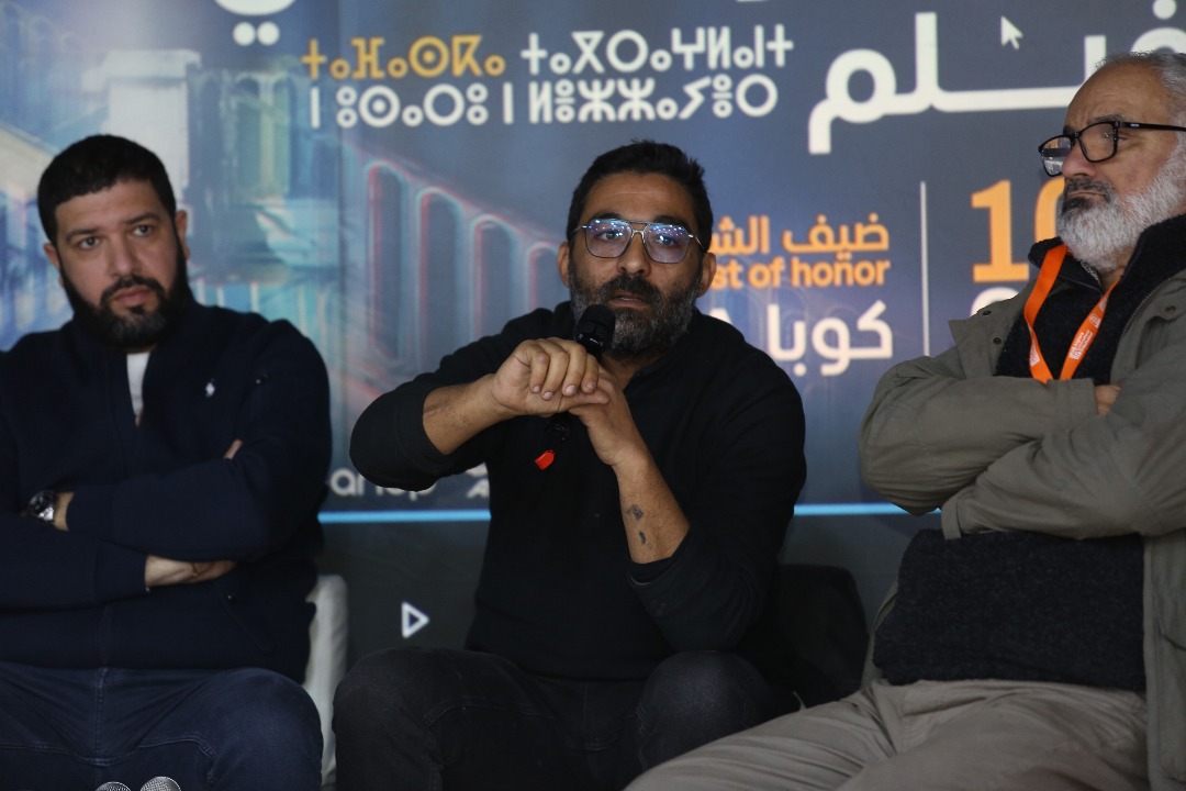 A cinema lesson titled “Dialogue Between Two Creatives,” featuring Rabah Slimani and Walid Aidoud,moderated by Montasser Outbetroun.